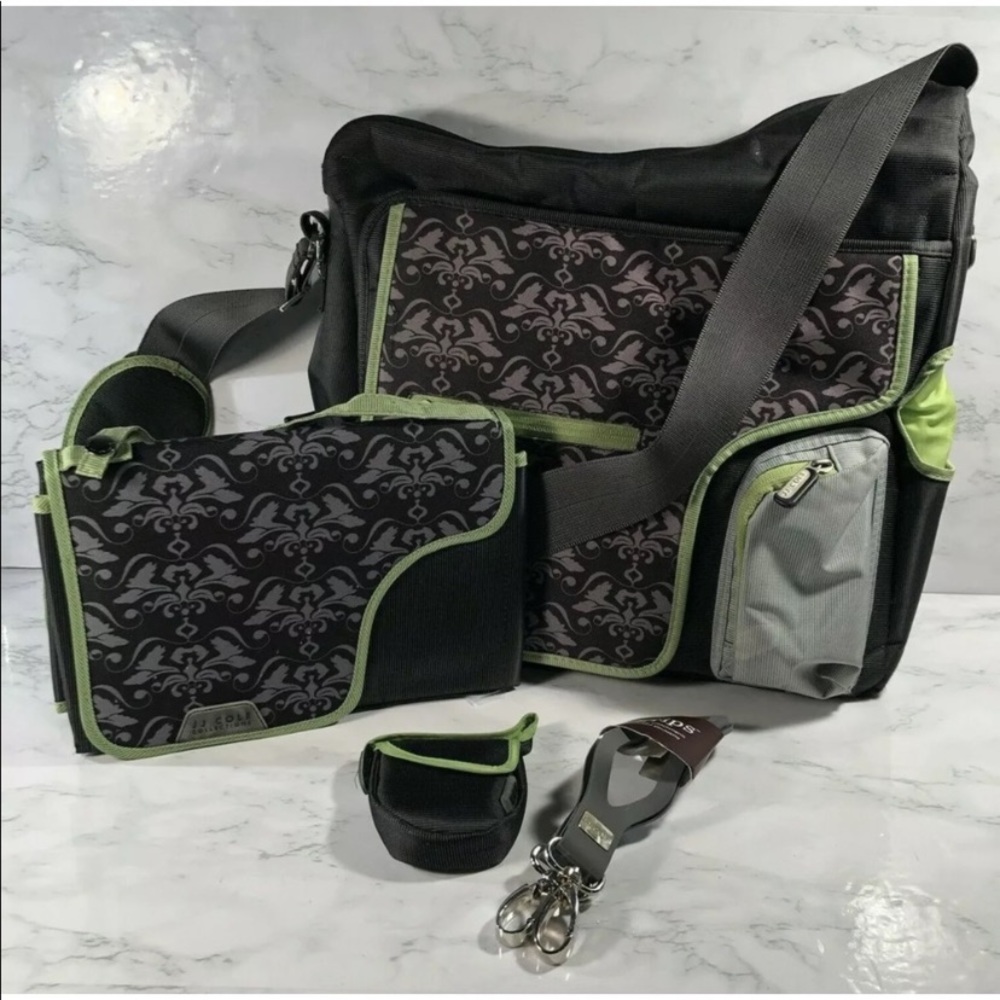 JJ coke diaper bag with changing pad and accessories in excellent condition